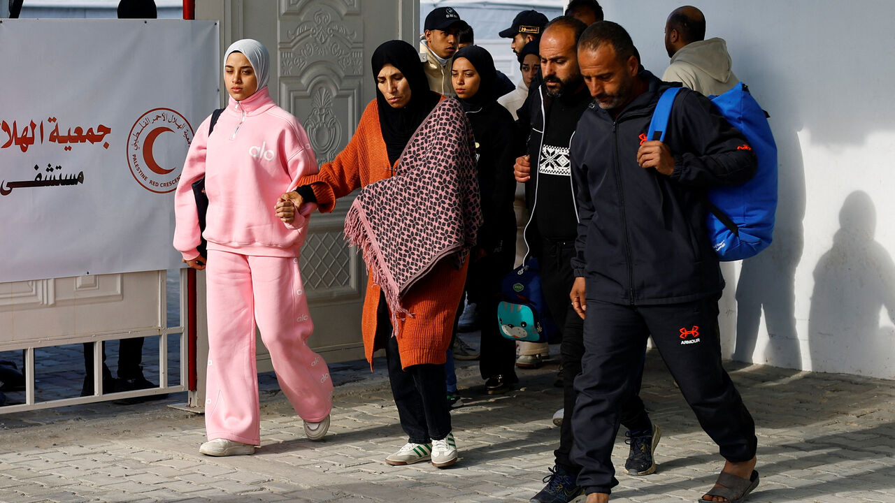 A Palestinian patient, accompanied by relatives, make their way back to their homes after being informed by officials that their travel scheduled for today through the Rafah border crossing was postponed, in Khan Younis in the southern Gaza Strip, February 4, 2026. REUTERS/Mahmoud Issa