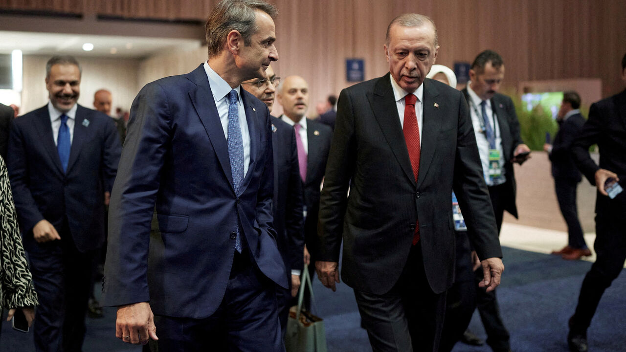 FILE PHOTO: Greek Prime Minister Kyriakos Mitsotakis and Turkish President Tayyip Erdogan meet on the sidelines of NATO Summit, in Washington, United States, July 10, 2024. Dimitris Papamitsos/Greek Prime Minister's Office/Handout via REUTERS/File Photo