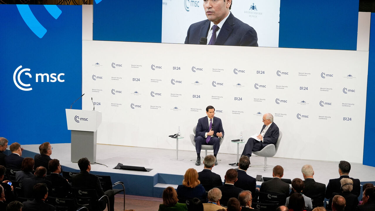 U.S. Secretary of State Marco Rubio speaks, next to the Chairman of the Munich Security Conference Wolfgang Ischinger, at the Munich Security Conference in Munich, Germany, February 14, 2026.     Alex Brandon/Pool via REUTERS