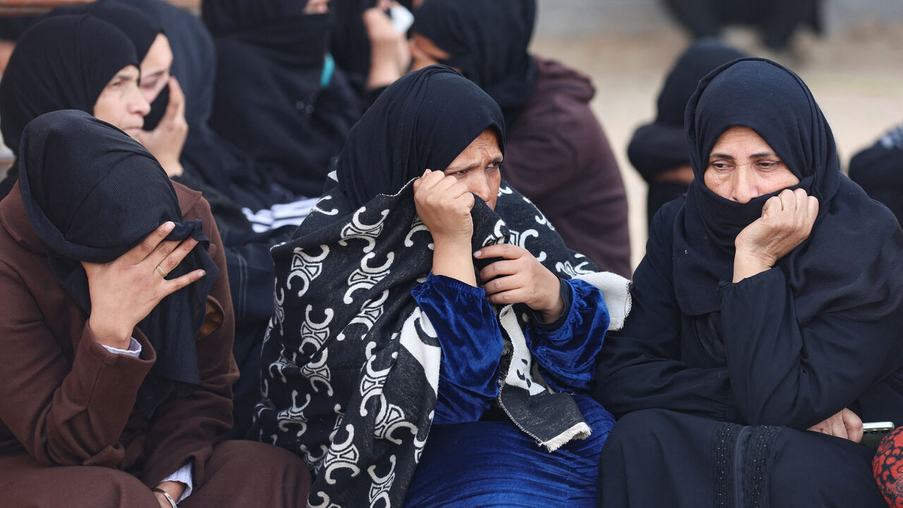 Mourners attend the funeral of Palestinians killed in an overnight Israeli strike, according to medics, at Nasser Hospital in Khan Younis in the southern Gaza Strip, February 15, 2026. REUTERS/Ramadan Abed