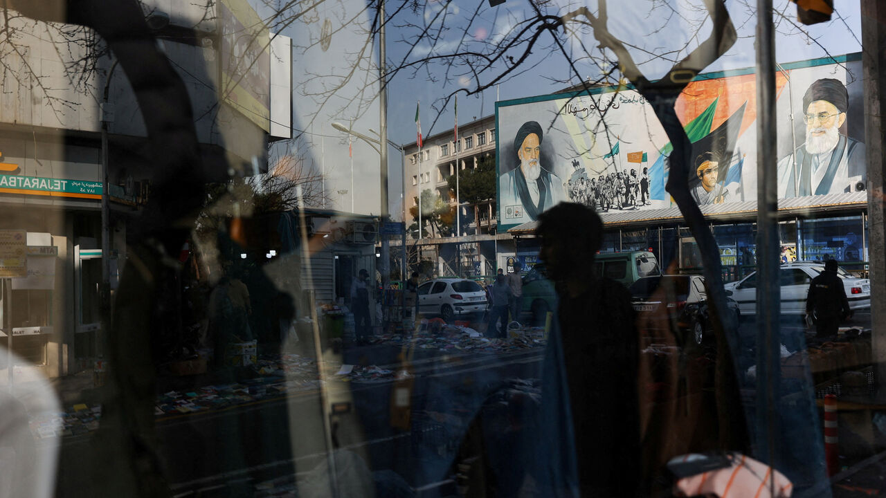 A sign with a depiction of Iran's Supreme Leader, Ayatollah Ali Khamenei, is reflected in a shop window in Tehran, Iran, February 19, 2026. Majid Asgaripour/WANA (West Asia News Agency) via REUTERS/File Photo