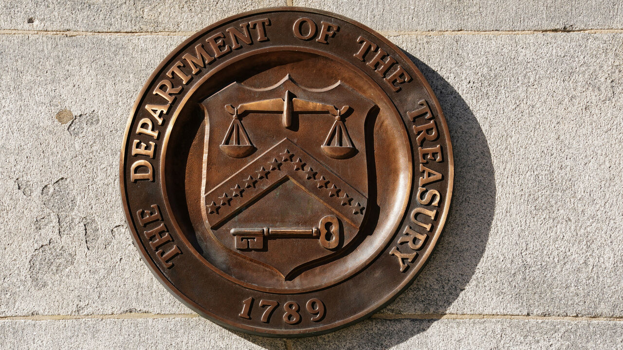 FILE PHOTO: A bronze seal for the Department of the Treasury is shown at the U.S. Treasury building in Washington, U.S., January 20, 2023.  REUTERS/Kevin Lamarque/File Photo