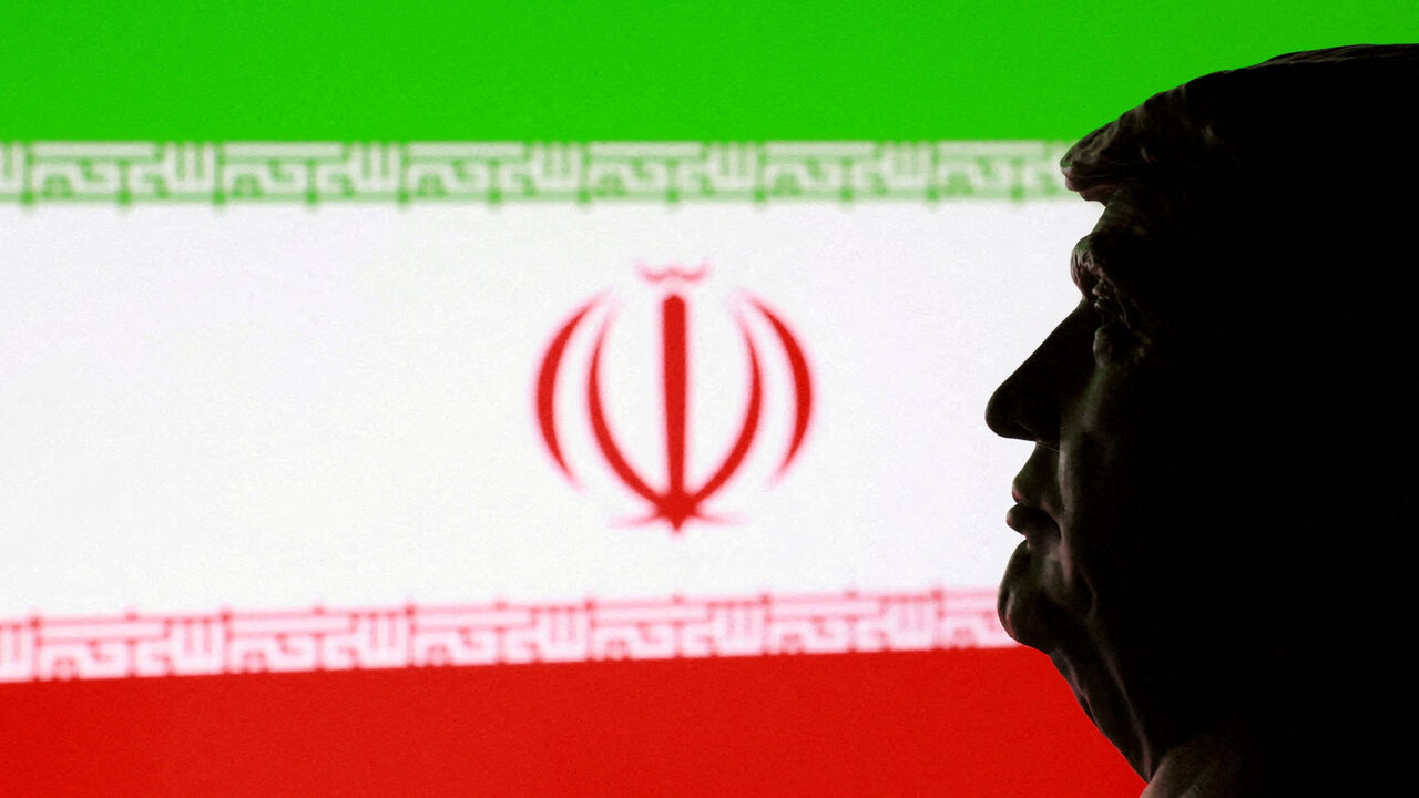 FILE PHOTO: A 3D printed miniature of U.S. President Donald Trump and Iranian flag are seen in this illustration taken January 9, 2026. REUTERS/Dado Ruvic/Illustration/File Photo