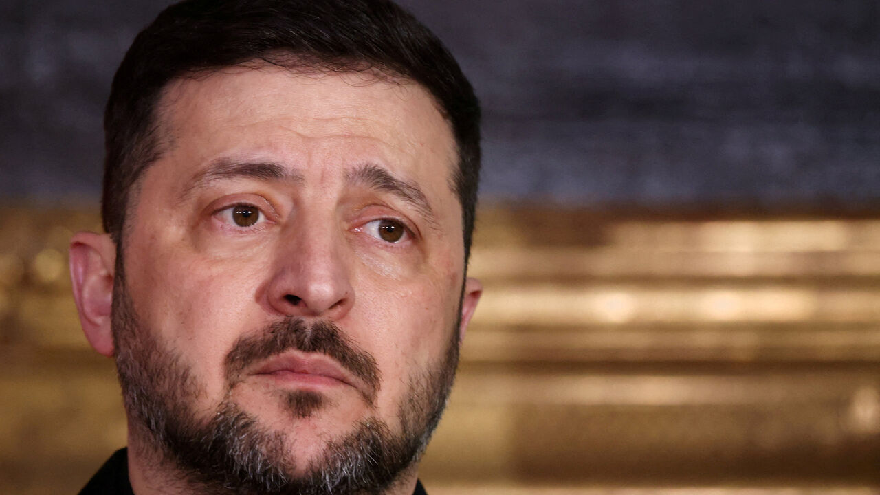 FILE PHOTO: Ukrainian President Volodymyr Zelenskiy looks on as he delivers a statement along with Bavarian federal state prime minister Markus Soeder (not pictured), chairman of the Munich Security Conference Wolfgang Ischinger (not pictured), Polish Prime Minister Donald Tusk (not pictured) during the Munich Security Conference MSC, at the Residenz of the former Bavarian Kings, in Munich, Germany, February 14, 2026. REUTERS/Liesa Johannssen/File Photo
