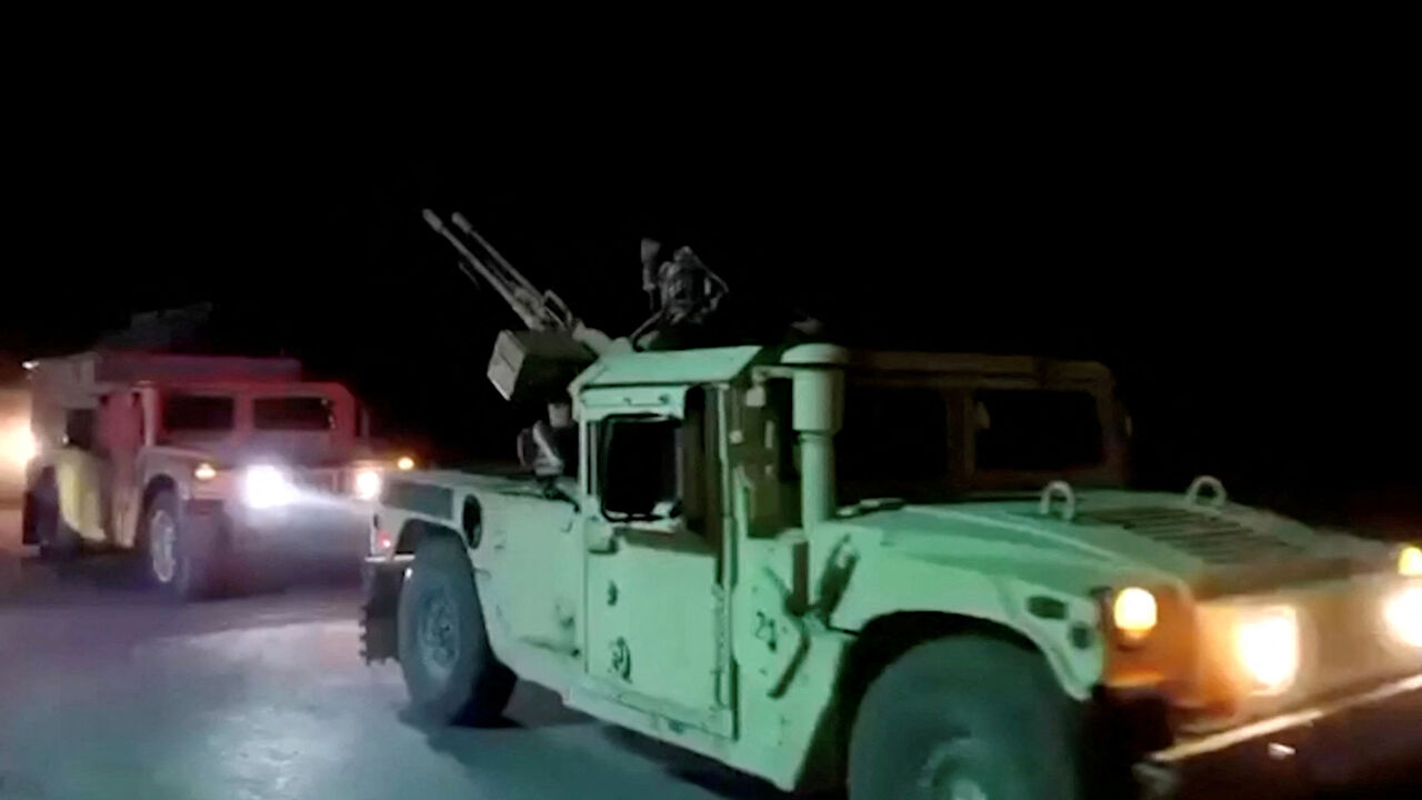 Military vehicles move on a road in a location given as Nangarhar, Afghanistan, in this screengrab from a handout video released on February 26, 2026. Pakistani and Afghan border forces clashed on Thursday night after the Taliban launched what it called retaliatory strikes on Pakistani installations, sharply escalating tensions after days of cross-border hostilities. Afghanistan's Ministry of Defense/Handout via REUTERS