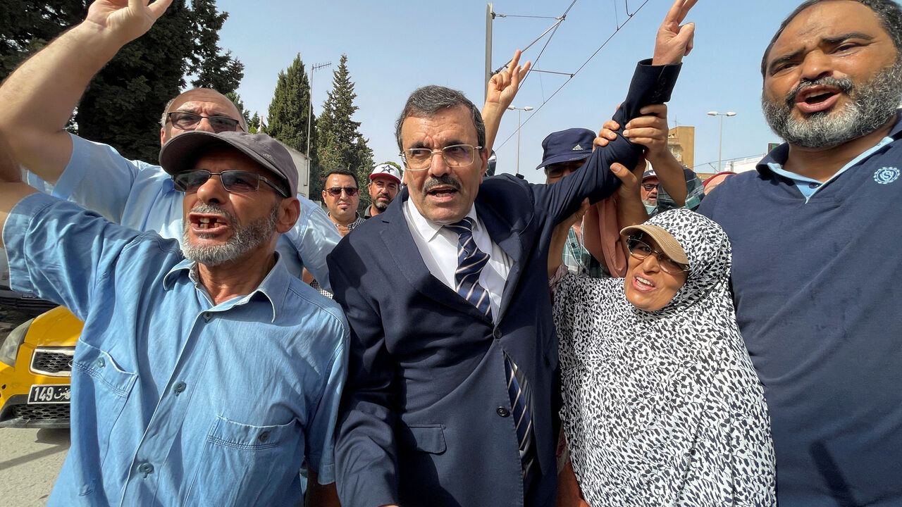 FILE PHOTO: Ali Larayedh, senior official of Tunisia's Islamist opposition party Ennahda and former prime minister, gestures while surrounded by his supporters, upon his arrival for questioning by anti-terrorism police, in Tunis,Tunisia September 19, 2022. REUTERS/Jihed Abidellaoui/File Photo