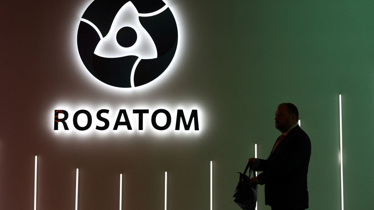 A participant walks past an exhibition stand of Russia's State Atomic Energy Corporation Rosatom at the Russian Energy Week international forum in Moscow, Russia, October 15, 2025. REUTERS/Ramil Sitdikov