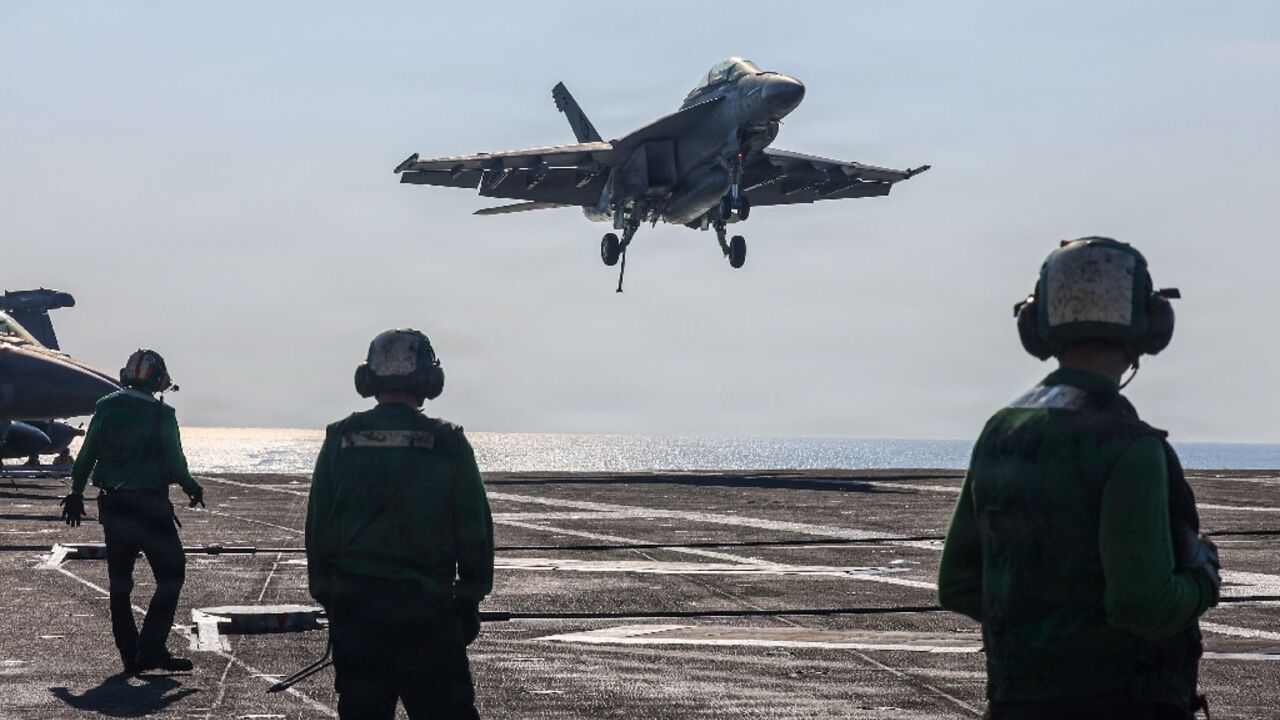 A US naval battle group led by the aircraft carrier USS Abrahem Lincoln is in waters near Iran. (Handout photograph) 