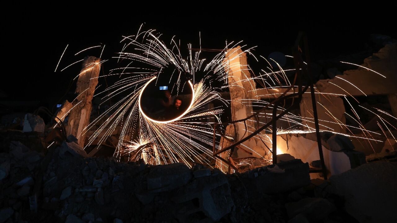 Displaced Palestinian light up fireworks in Gaza as Ramadan begin