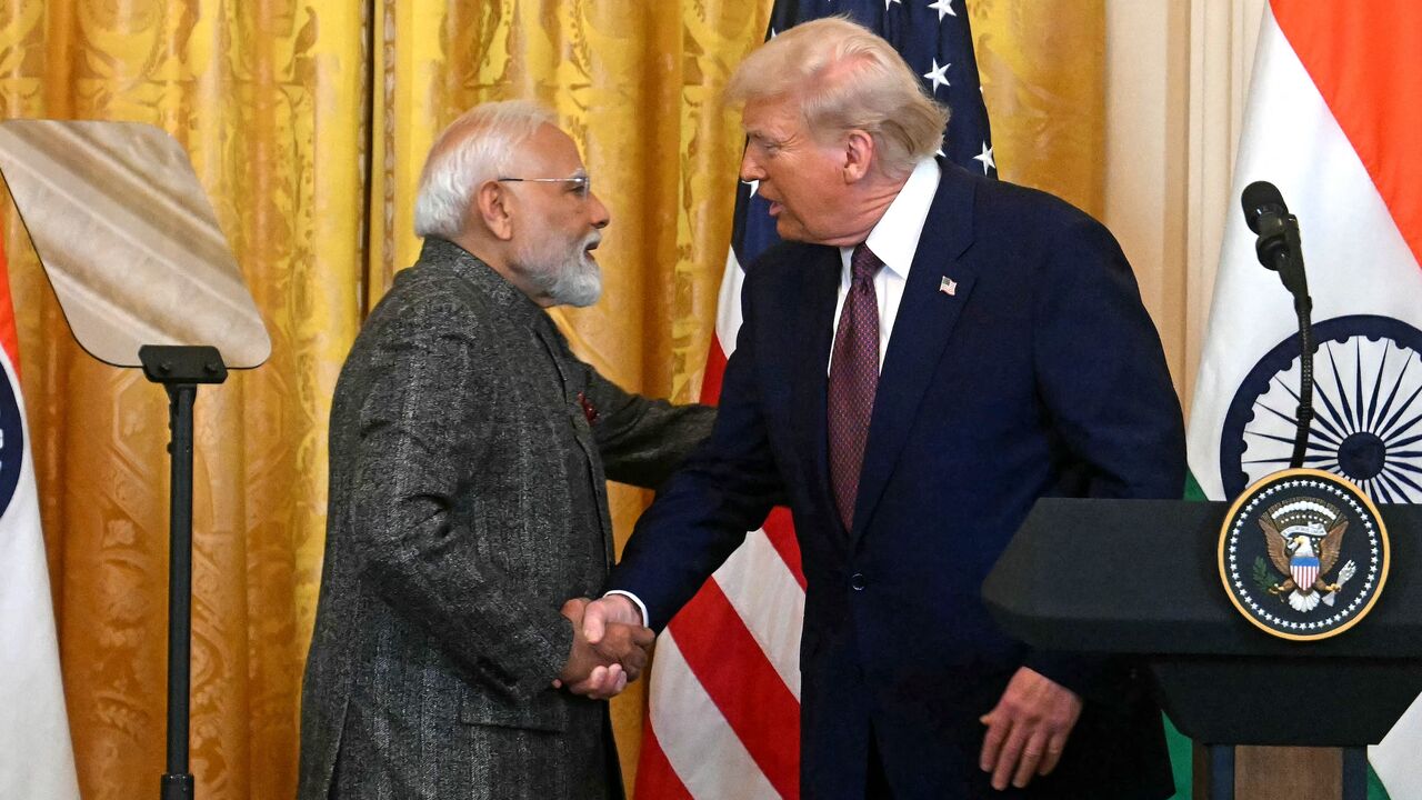 US President Donald Trump shakes hands with Indian Prime Minister Narendra Modi during a joint press conference in the East Room of the White House in Washington, on Feb. 13, 2025.
