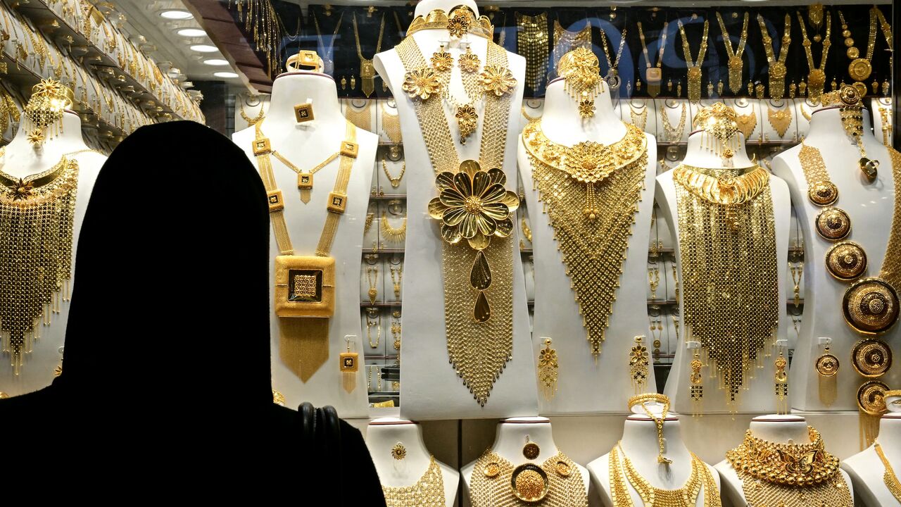 A woman checks a window shop at a jewelry store in Dubai, on March 10, 2025.