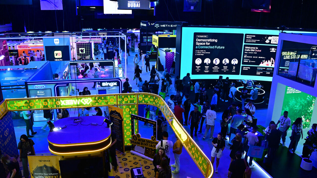 Participants visit the Token 2049 crypto conference in Dubai on May 1, 2025. 