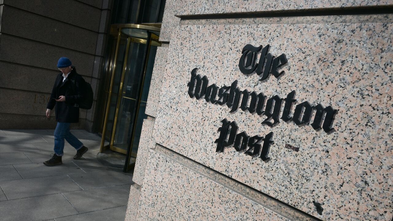 A man exits the Washington Post office building in Washington, DC, on Feb. 4, 2026. 