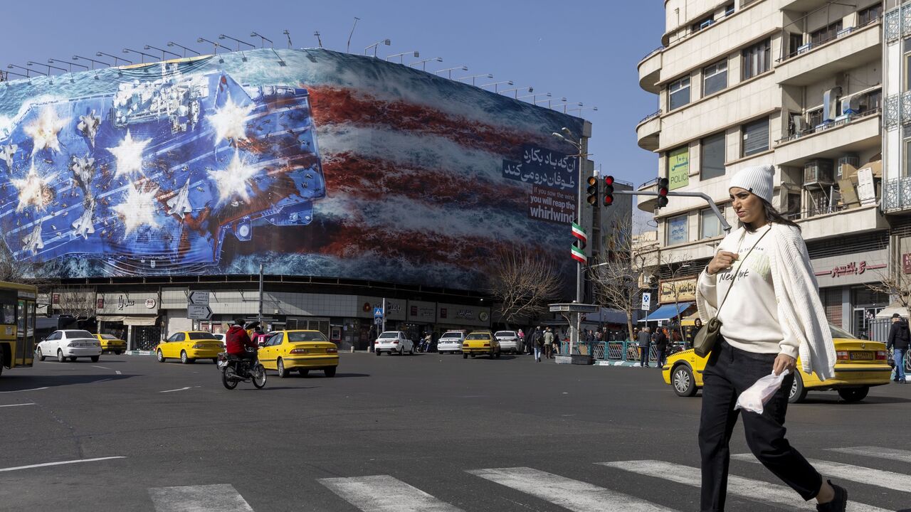 A state building is covered with a giant anti-US billboard depicting a symbolic image of the destroyed USS Abraham Lincoln aircraft carrier in downtown Tehran, Iran, on Feb. 1, 2026. 