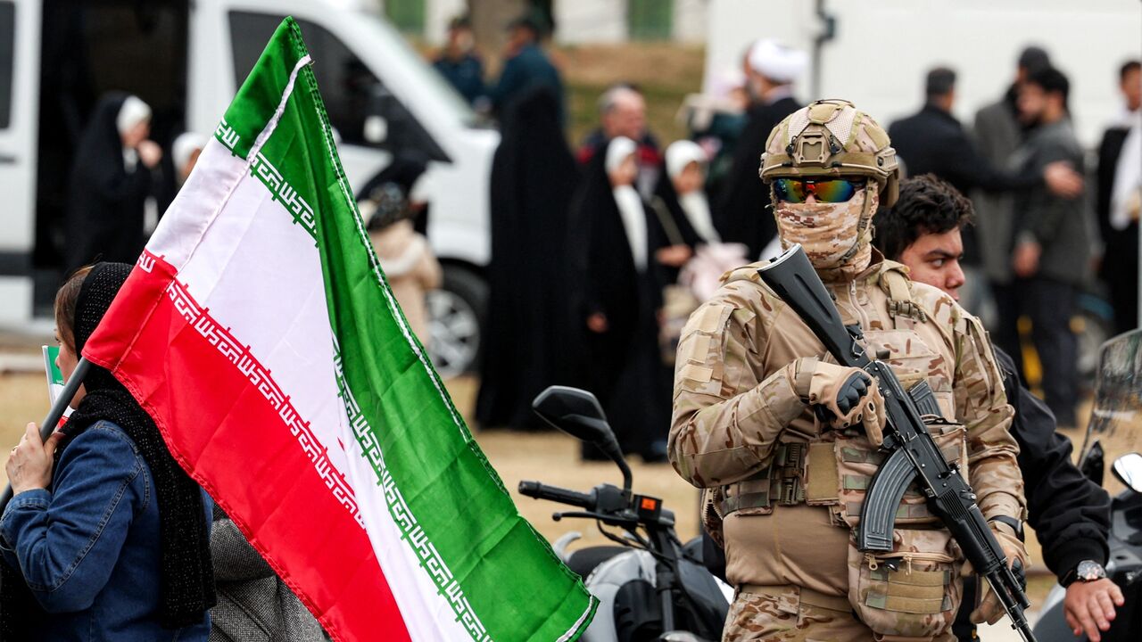 A member of the security forces stands guard during a rally marking the 47th anniversary of the 1979 Islamic Revolution in Tehran on Feb. 11, 2026. 