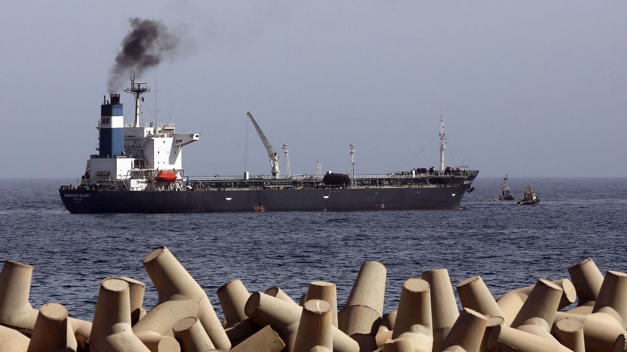 A general view taken on April 4, 2014, shows oil tanker Morning Glory, during the unloading of oil in the Libyan seaport of Zawiya. 