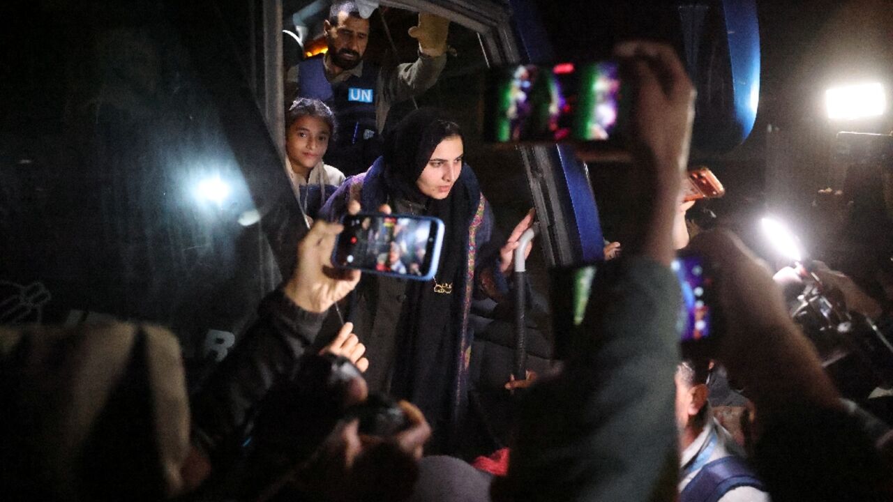 Palestinians arrive at a hospital in Khan Yunis after crossing from Egypt