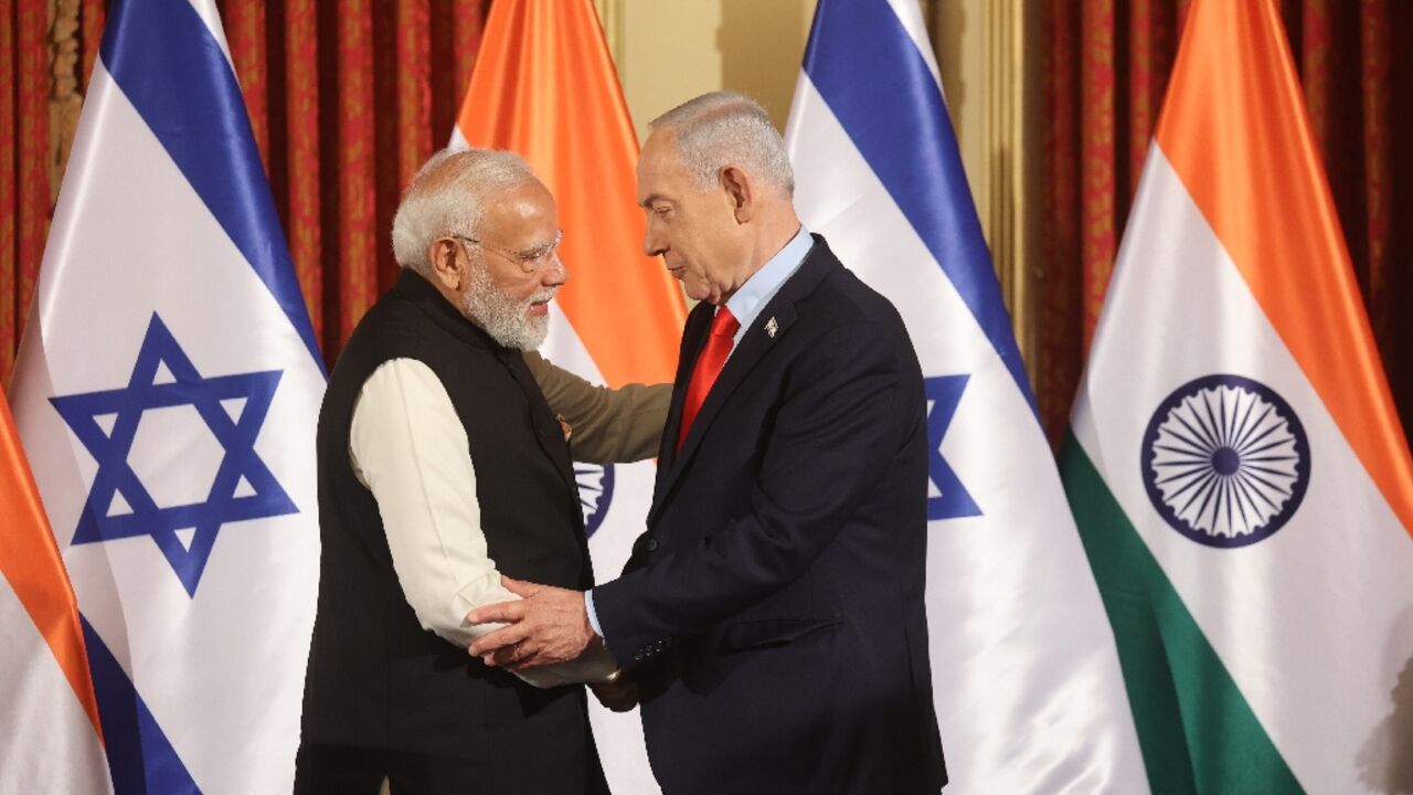 Modi shakes hands with Netanyahu during the Indian leader's visit to Israel