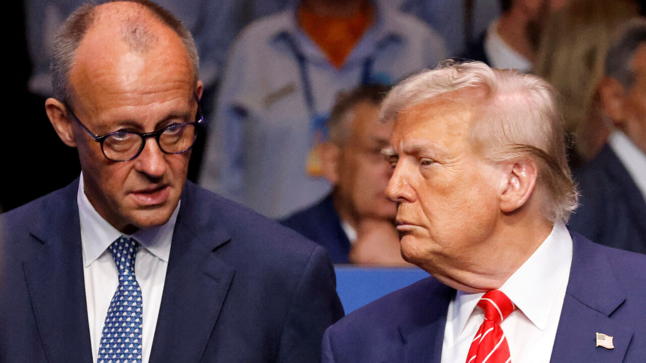 Germany's Chancellor Friedrich Merz speaks with US President Donald Trump before the start of the North Atlantic Council plenary meeting at the North Atlantic Treaty Organisation (NATO) summit in The Hague on June 25, 2025.      LUDOVIC MARIN/Pool via REUTERS/File Photo
