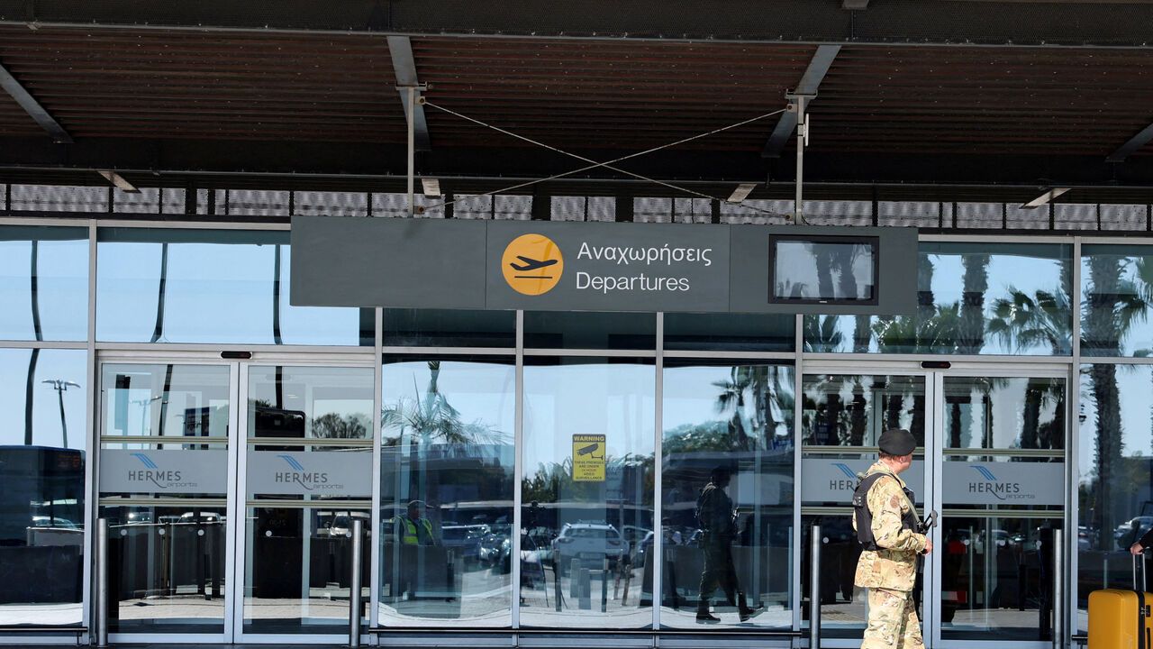 Police officer patrols at Paphos International Airport in Paphos, Cyprus January 27, 2025.  REUTERS/Yiannis Kourtoglou