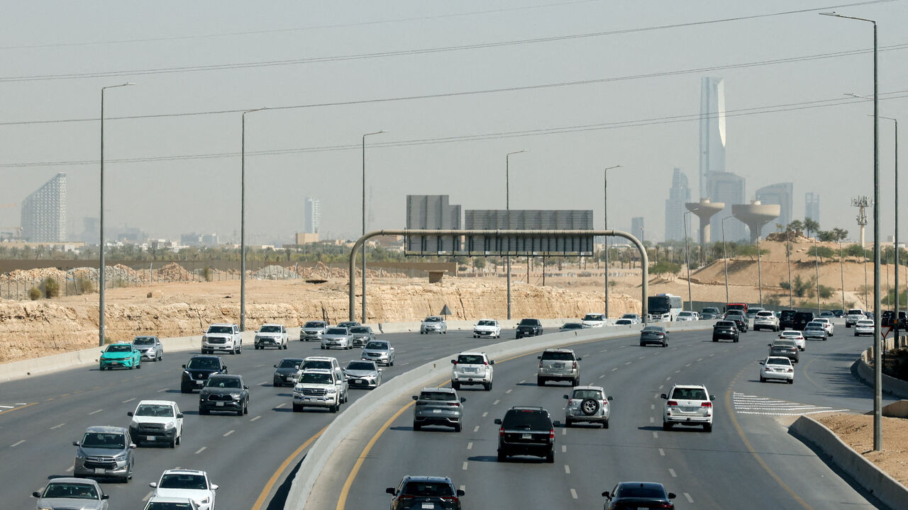 FILE PHOTO: Traffic moves on a road, with the city's skyline visible in the background, in Riyadh, Saudi Arabia, February 9, 2026. REUTERS/Isabel Infantes/File Photo