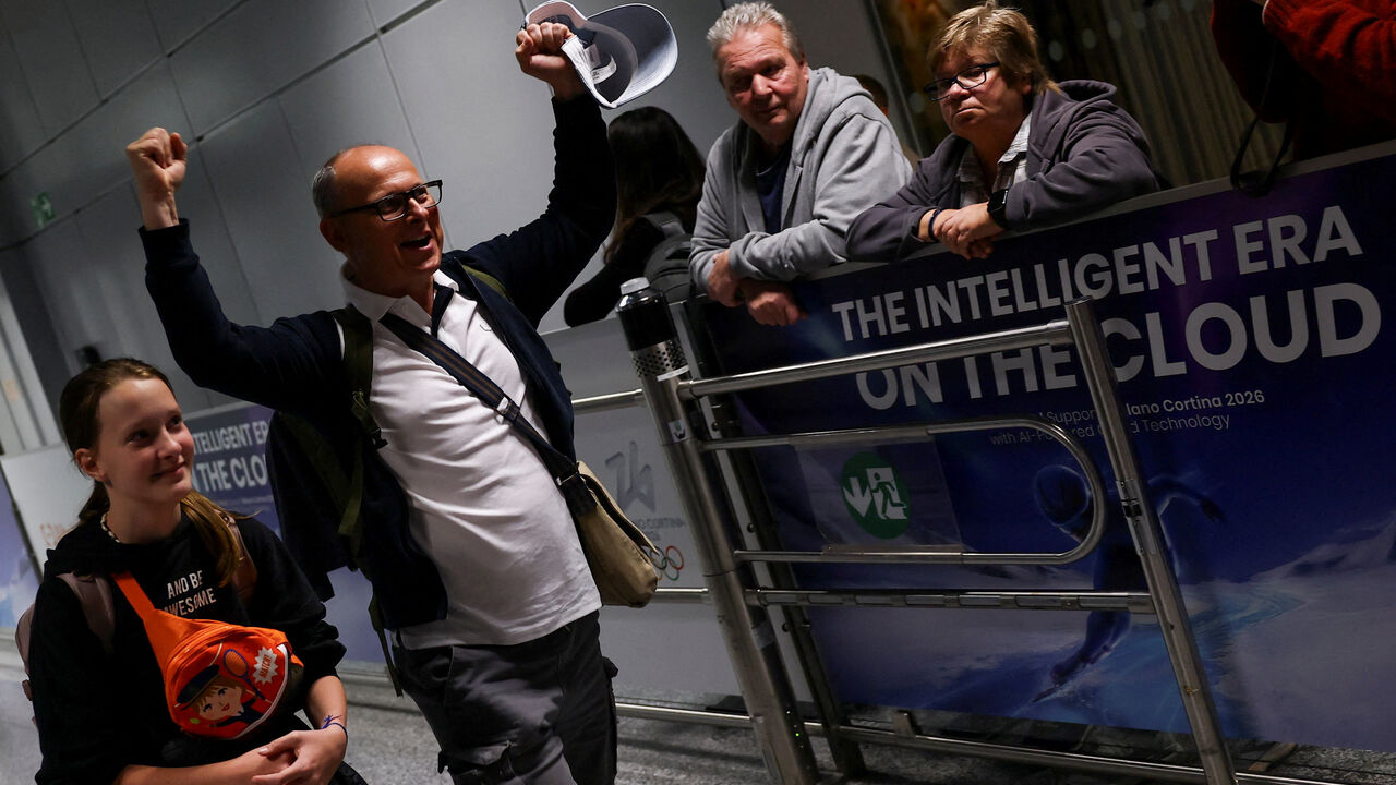 An unidentified passenger gestures following the evacuation from Dubai, amid the U.S.-Israeli conflict with Iran, at the airport in Frankfurt, Germany, March 3, 2026. REUTERS/Kai Pfaffenbach