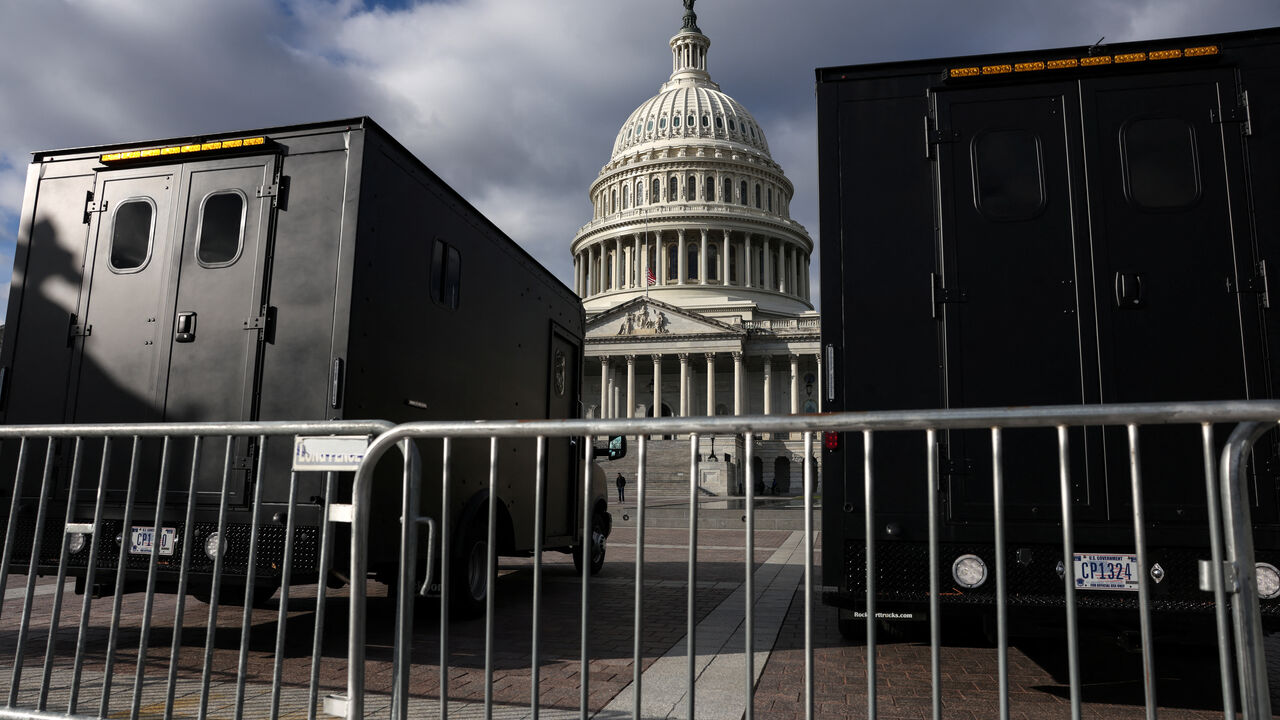 Police vehicles are parked outside the US Capitol building in Washington, U.S., January 2, 2025. REUTERS/Evelyn Hockstein