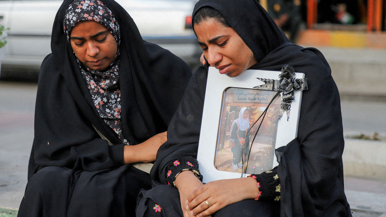 FILE PHOTO: People mourn on the day of the funeral of the victims following a reported strike on a school in Minab, Iran, March 3, 2026. Amirhossein Khorgooei/ISNA/WANA (West Asia News Agency) via REUTERS
