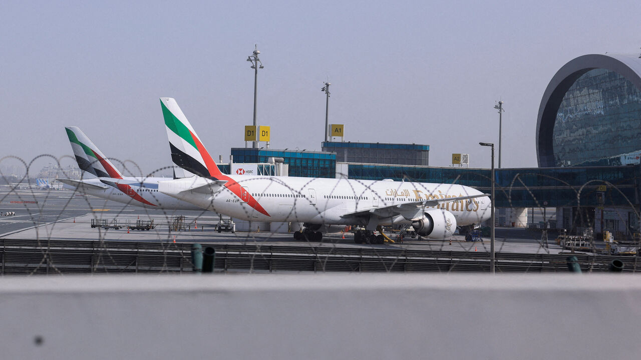 FILE PHOTO: Planes are parked at Terminal 3 of the Dubai International Airport, following the United States and Israel strikes on Iran, in Dubai, United Arab Emirates, March 2, 2026. REUTERS/Raghed Waked/File Photo