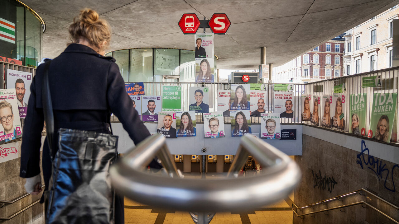 Election posters hang above the entrance of Noerreport Station in Copenhagen, Denmark, March 3, 2026. Ritzau Scanpix/Sebastian Elias Uth via REUTERS