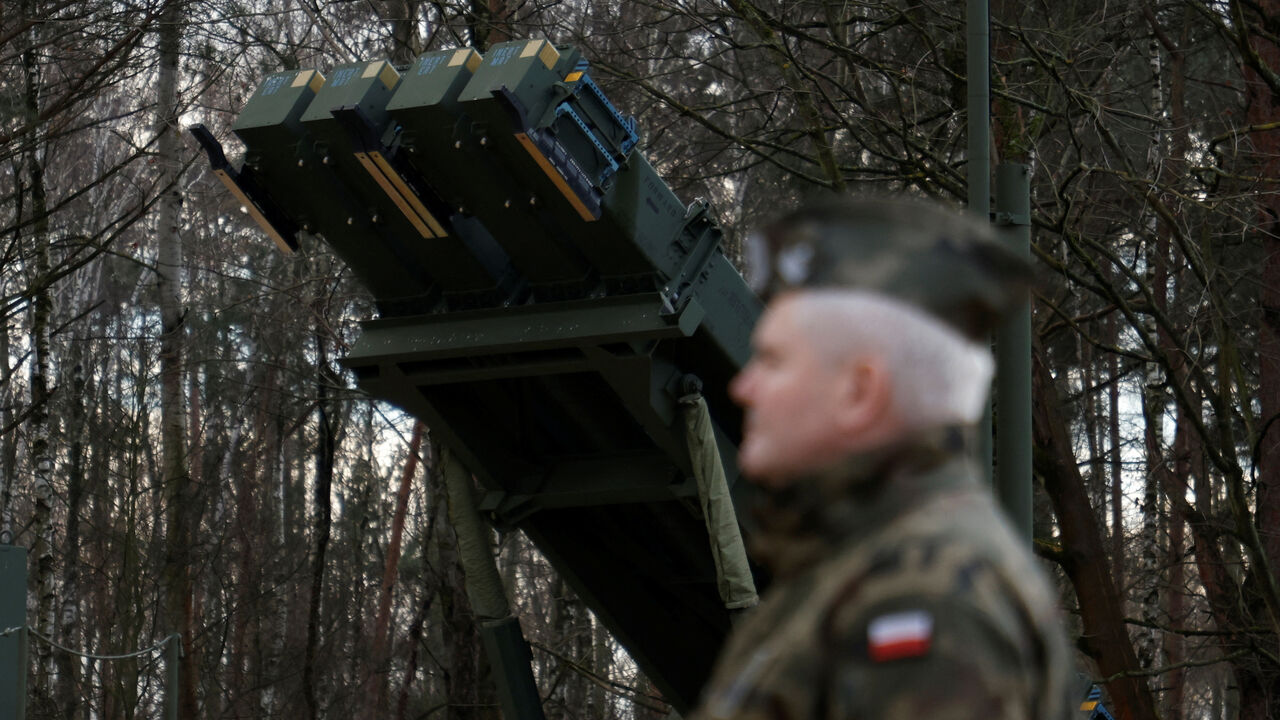 Polish army general stands in front of the surface-to-air missile launcher, the Patriot (Wisla) system, newly added into the Integrated Battle Command System (IBCS) at an army base in Sochaczew, Poland, December 18, 2024. REUTERS/Kuba Stezycki