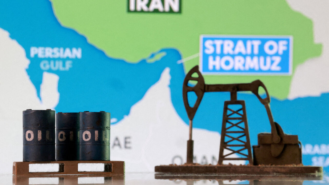 3D-printed oil barrels, an oil pump jack and a map showing the Strait of Hormuz and Iran appear in this illustration taken March 2, 2026. REUTERS/Dado Ruvic/Illustration