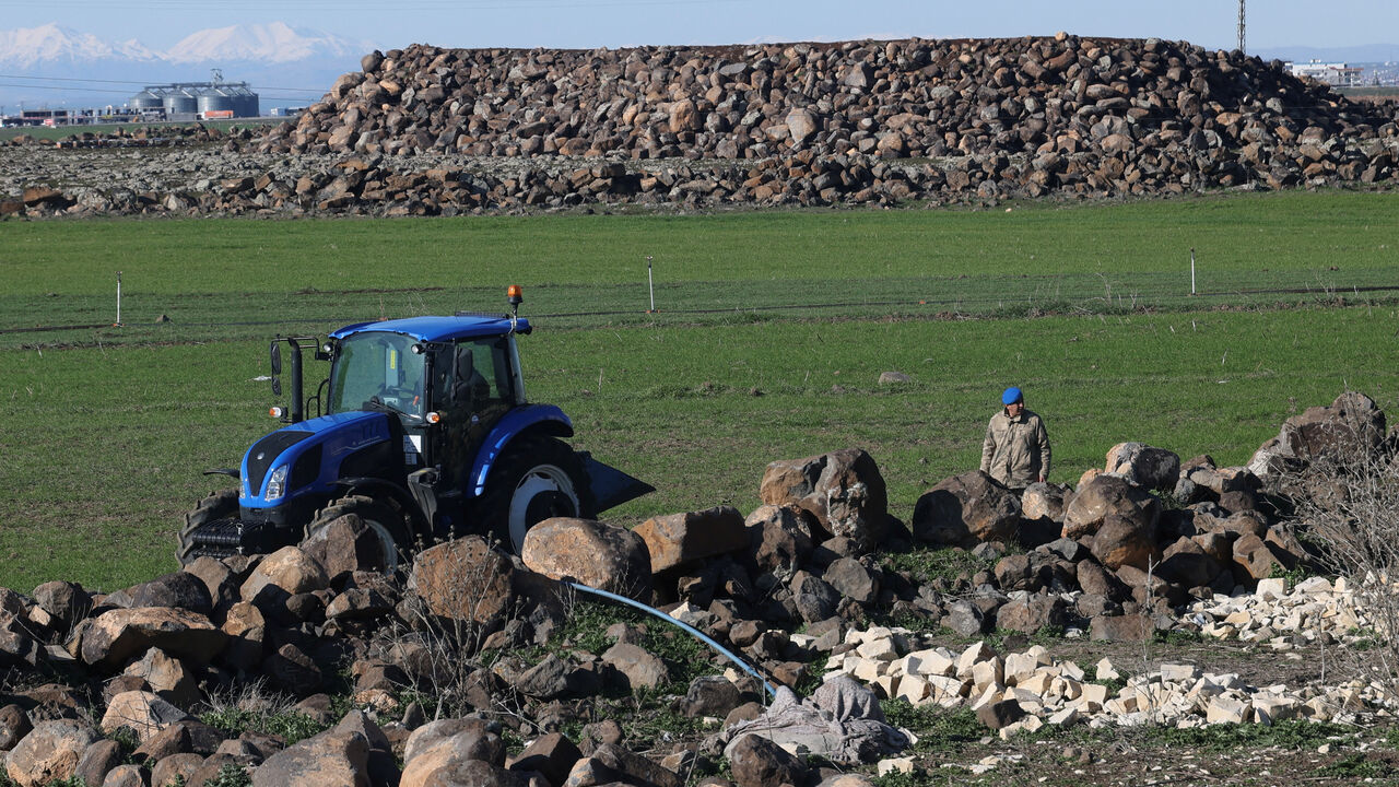 A Turkish army personnel walks as they search a field after a piece of ammunition fell following the interception of a missile launched from Iran by a NATO air defence system, in Diyarbakir, Turkey, March 9, 2026. REUTERS/Sertac Kayar