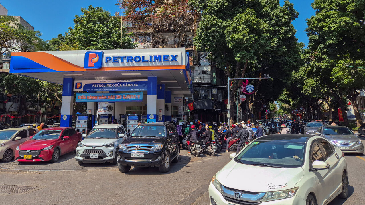 People queue to buy petrol at a petrol station after Vietnam's trade ministry called on local businesses to encourage their employees to work from home to save fuel amid disruptions in supply and price surges triggered by the U.S.-Israeli conflict with Iran, in Hanoi, Vietnam, March 10, 2026. Picture taken with a mobile phone. REUTERS/Khanh Vu