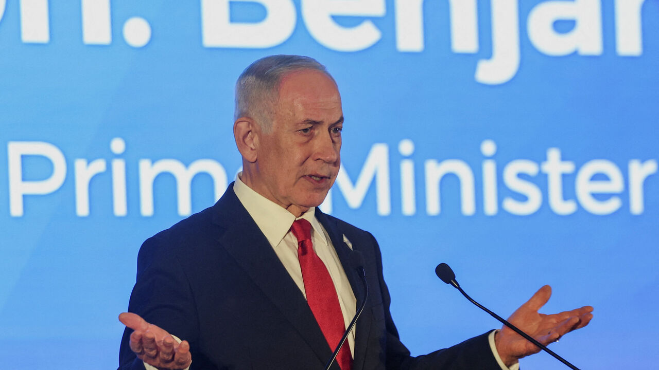 Israeli Prime Minister Benjamin Netanyahu gestures as he speaks during the Conference of Presidents of Major American Jewish Organisations, in Jerusalem, February 15, 2026. REUTERS/Ronen Zvulun