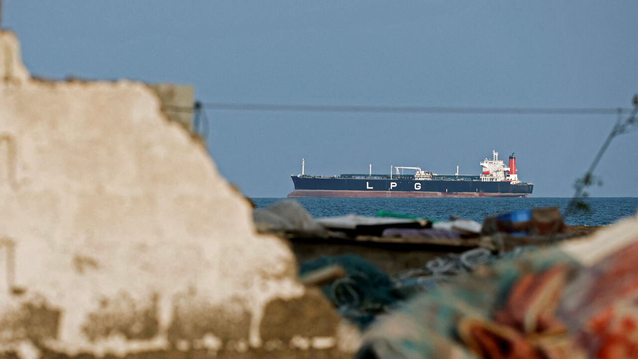 FILE PHOTO: A LPG gas tanker sits anchored as the traffic is down in the Strait of Hormuz, amid the U.S.-Israeli conflict with Iran, in Shinas, Oman, March 11, 2026. REUTERS/Benoit Tessier/File Photo
