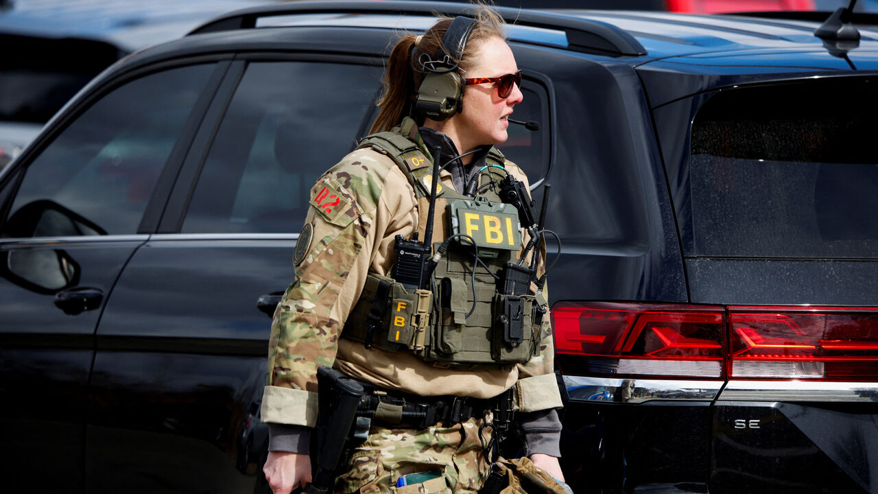 An FBI member works on the site after the Michigan State Police reported an active shooting incident at the Temple Israel Synagogue in West Bloomfield, Michigan, U.S., March 12, 2026. REUTERS/Rebecca Cook