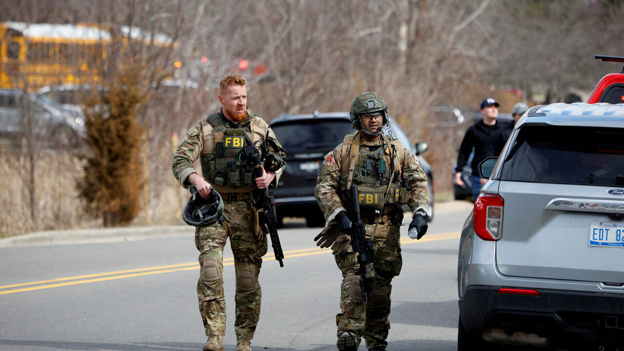 FILE PHOTO: FBI members work on the site after the Michigan State Police reported an active shooting incident at the Temple Israel Synagogue in West Bloomfield, Michigan, U.S., March 12, 2026. REUTERS/Rebecca Cook/File Photo