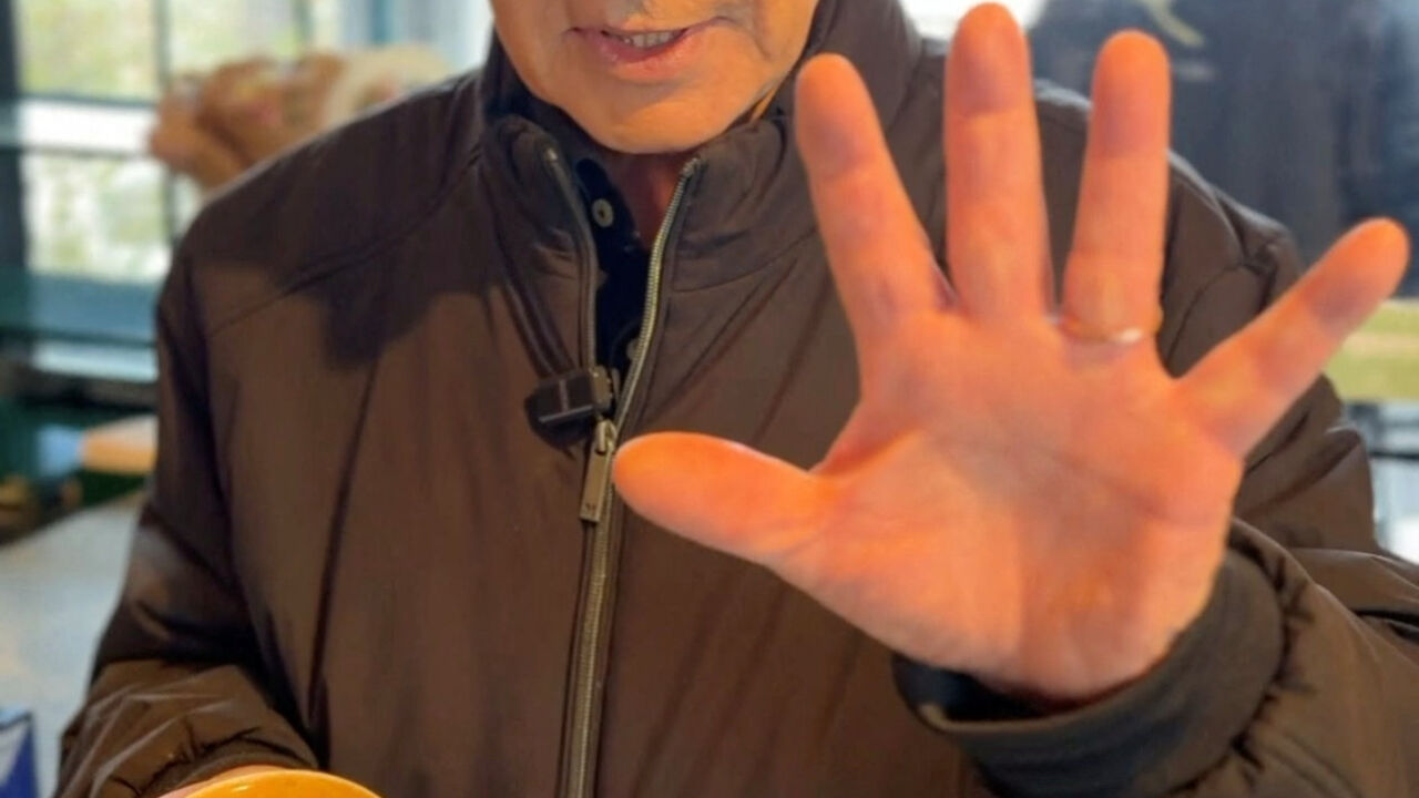 Israeli Prime Minister Benjamin Netanyahu shows his hand as he speaks at a cafe, amid the U.S.-Israeli conflict with Iran, in Jerusalem, March 15, 2026, in this screen grab taken from a handout video. Benjamin Netanyahu via Telegram/Handout via REU