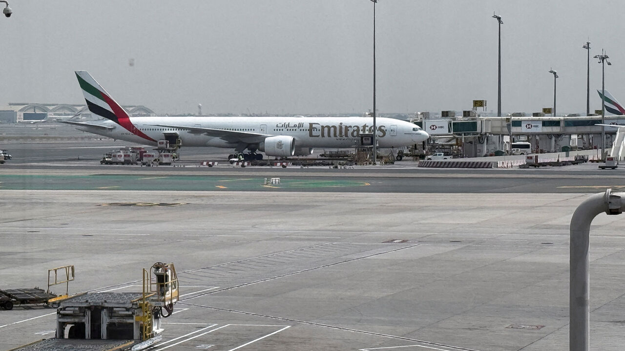 An Emirates airplane at Dubai International Airport, amid the U.S.-Israeli conflict with Iran, in Dubai, United Arab Emirates, March 8, 2026. Picture taken by phone. REUTERS/Stringer