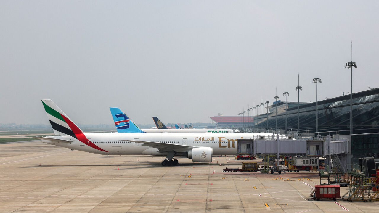 Planes are parked at Noi Bai International Airport amid regional airspace closures, amid the U.S.-Israel conflict with Iran, in Hanoi, Vietnam, March 2, 2026. REUTERS/Thinh Nguyen