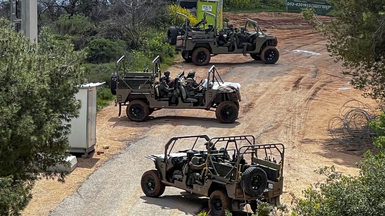 Israeli soldiers in military vehicles on the Israeli side of the Israel-Lebanon border, amid escalation between Hezbollah and Israel, and amid the U.S.-Israeli conflict with Iran, in northern Israel, March 16, 2026. REUTERS/Avi Ohayon