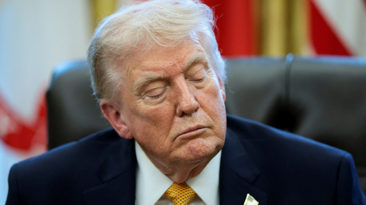 U.S. President Donald Trump listens to a question from a reporter during an event to sign an executive order creating an anti‑fraud task force headed by U.S. Vice President JD Vance in the Oval Office at the White House in Washington, D.C., U.S., March 16, 2026. REUTERS/Jonathan Ernst