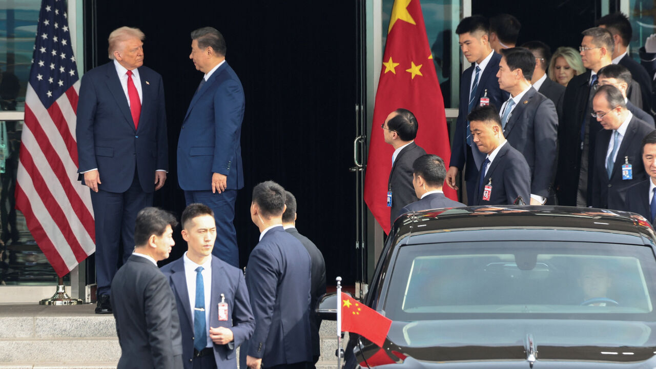 U.S. President Donald Trump and Chinese President Xi Jinping talk as they leave after a bilateral meeting at Gimhae International Airport, on the sidelines of the Asia-Pacific Economic Cooperation (APEC) summit, in Busan, South Korea, October 30, 2025. REUTERS/Evelyn Hockstein