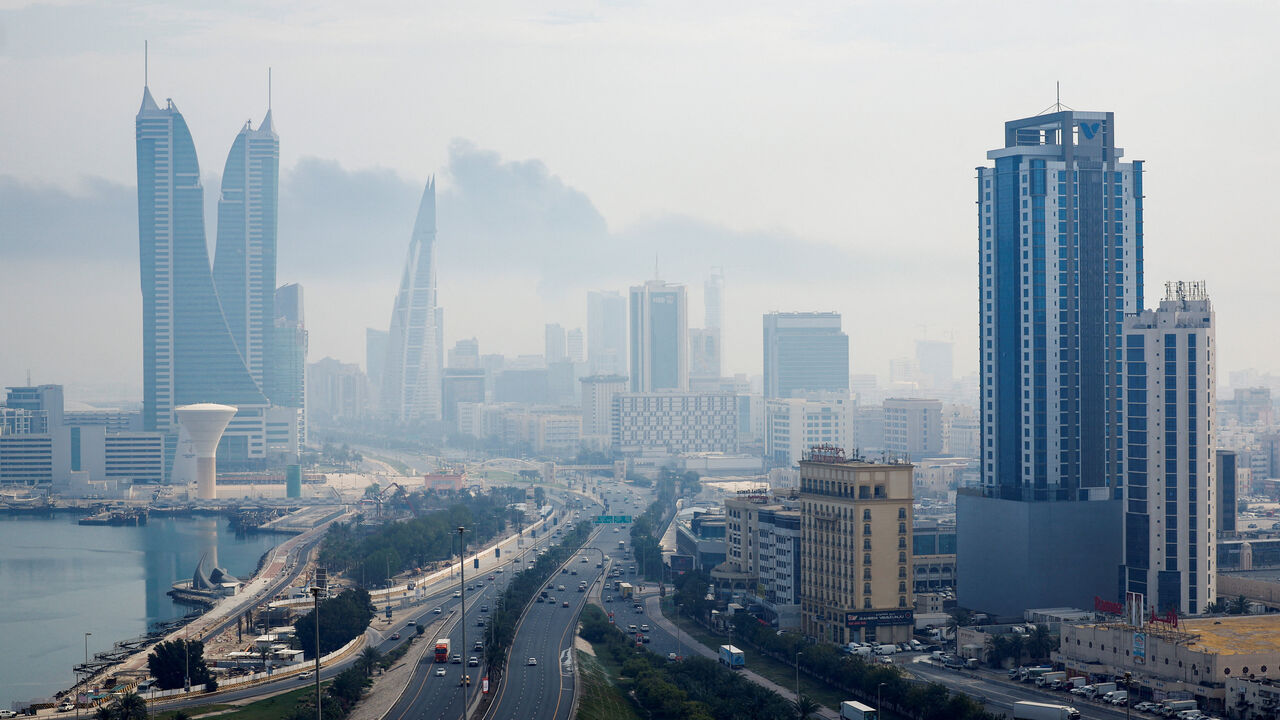 Smoke rises over the capital Manama, following a reported Iranian drone strike on the fuel storage facility of Bahrain International Airport, amid the U.S.-Israeli conflict with Iran, in Muharraq, Manama, Bahrain, March 12, 2026. REUTERS/Stringer/File Photo