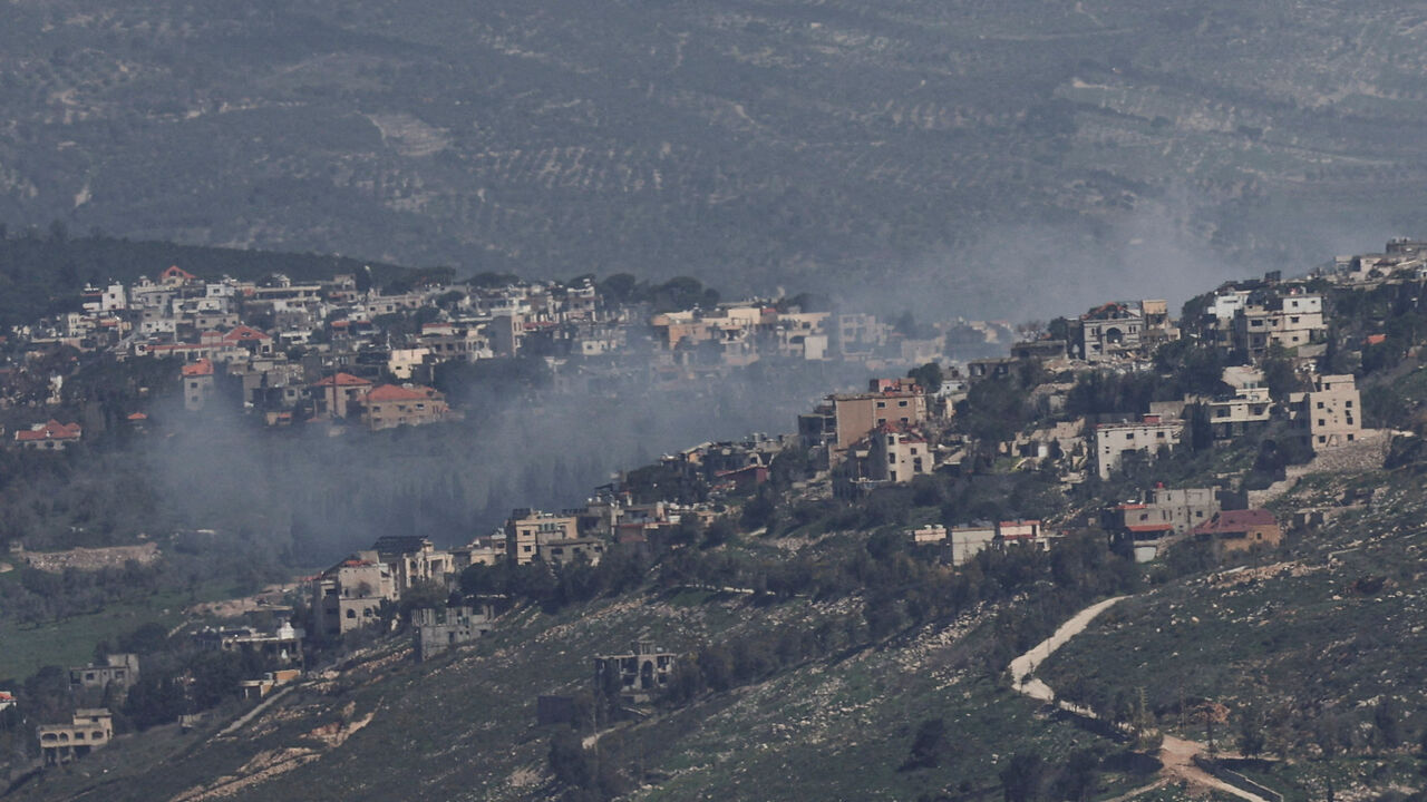 FILE PHOTO: Smoke rises from a Lebanese village near the border with Israel, amid escalation between Iran-backed Hezbollah and Israel, and amid the U.S.-Israeli conflict with Iran, as seen from northern Israel, March 19, 2026. REUTERS/Tyrone Siu/File Photo
