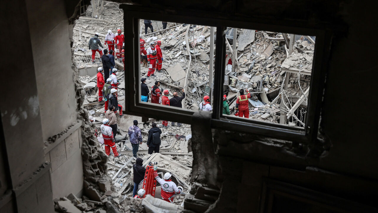 Emergency personnel work at the site of a strike on a residential building, amid the U.S.-Israeli conflict with Iran, in Tehran, Iran, March 16, 2026. Majid Asgaripour/WANA (West Asia News Agency) via REUTERS