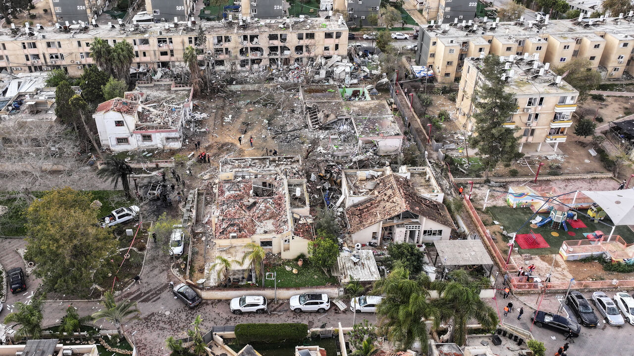 A drone view shows a damage in a residential neighbourhood, following a night of Iranian missile strikes which injured dozens of Israelis, amid the U.S.-Israel conflict with Iran, in Dimona, southern Israel March 22, 2026. REUTERS/Roei Kastro