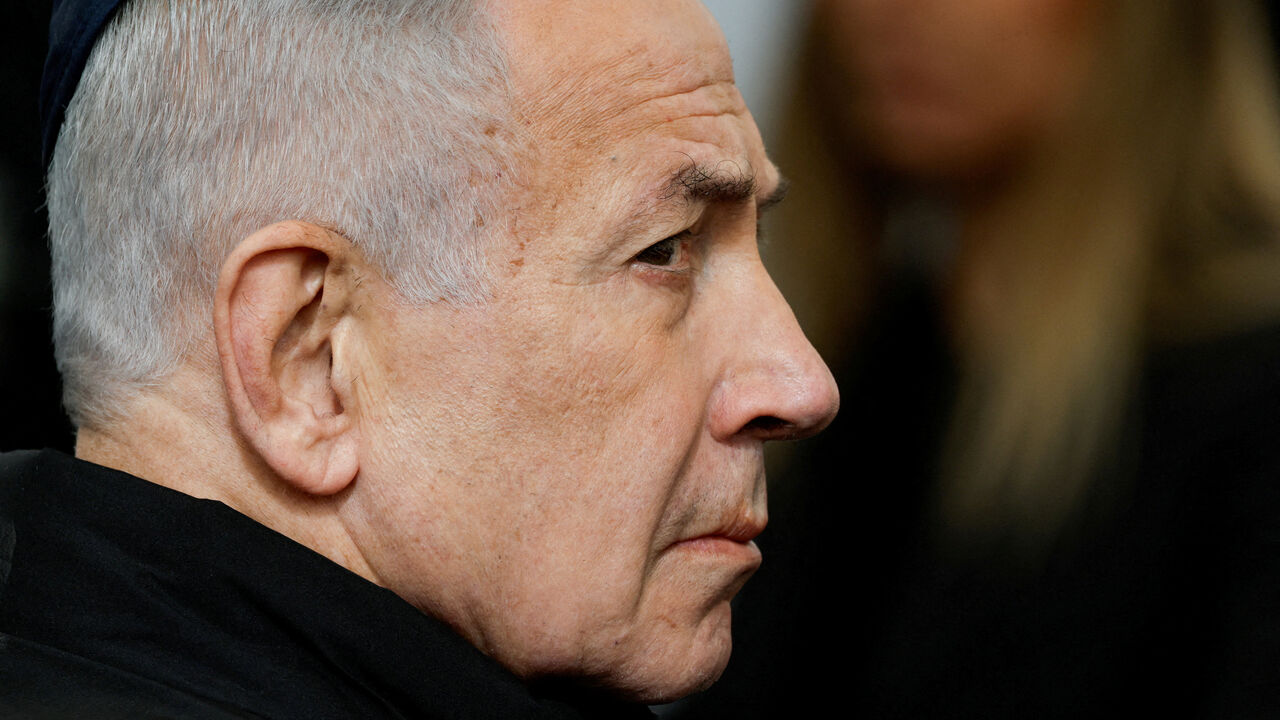 FILE PHOTO: Israeli Prime Minister Benjamin Netanyahu attends a memorial service held for Ran Gvili, an off-duty police officer who was killed fighting militants that had infiltrated Israel during the deadly October 7, 2023, attack by Hamas, and the last hostage recovered from Gaza, in Meitar, Israel, January 28, 2026. REUTERS/Amir Cohen/File Photo
