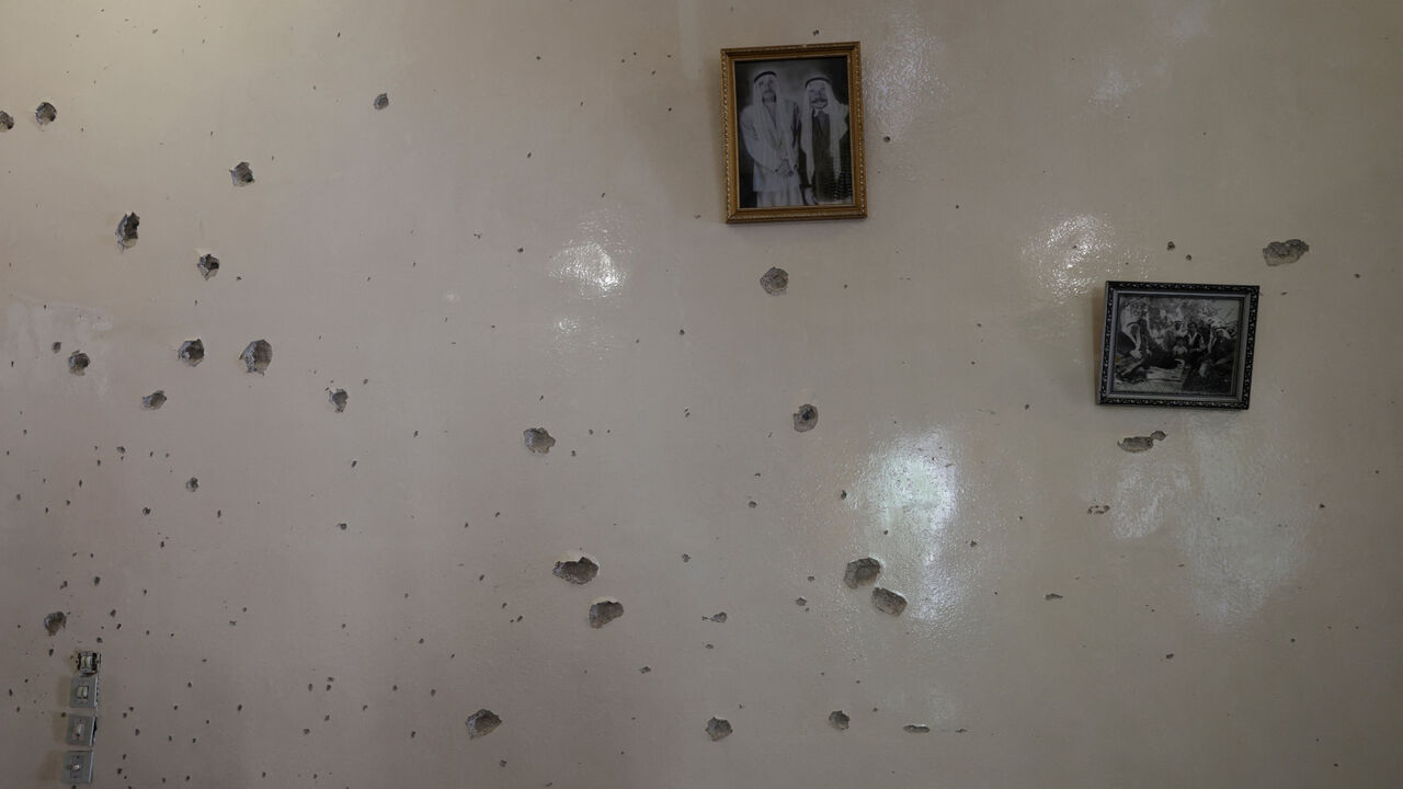 FILE PHOTO: A wall is pockmarked by bullet holes inside the Saraya family house, following sectarian violence in Syria's Sweida province, where government forces were sent to quell local clashes between Druze armed factions and Bedouin tribal fighters, in the predominantly Druze city of Sweida, Syria, July 25, 2025. REUTERS/Khalil Ashawi/File Photo